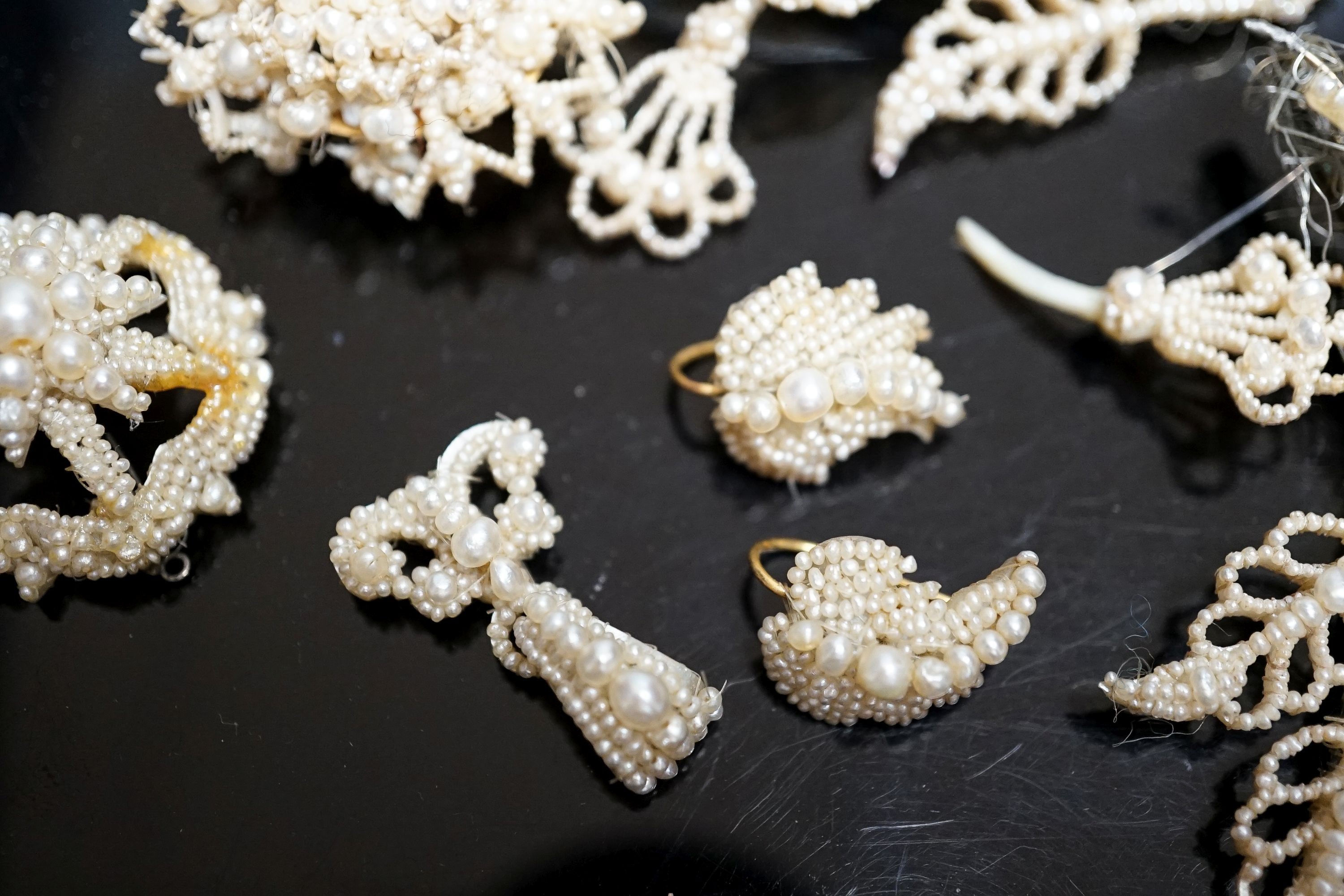 A 19th century seed pearl set flower brooch, 95mm and five other pieces of seed pearl jewellery.